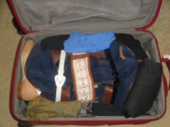 I wrapped my belts around the small duffel (which is filled with underwear, socks, tights, and camisoles) to compress it and fit more clothes into the suitcase.